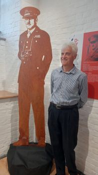 Brian standing beside a cut out of our grandfather